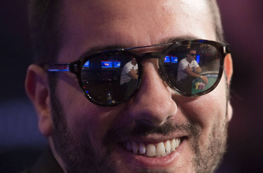 Dario Sammartino, from Italy, smiles at fans during the World Series of Poker Main Event on Tue ...