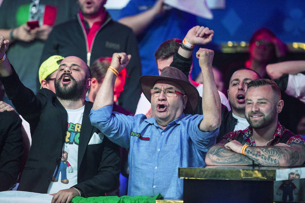 Fans of Italian poker player Dario Sammartino cheer during the World Series of Poker Main Even ...