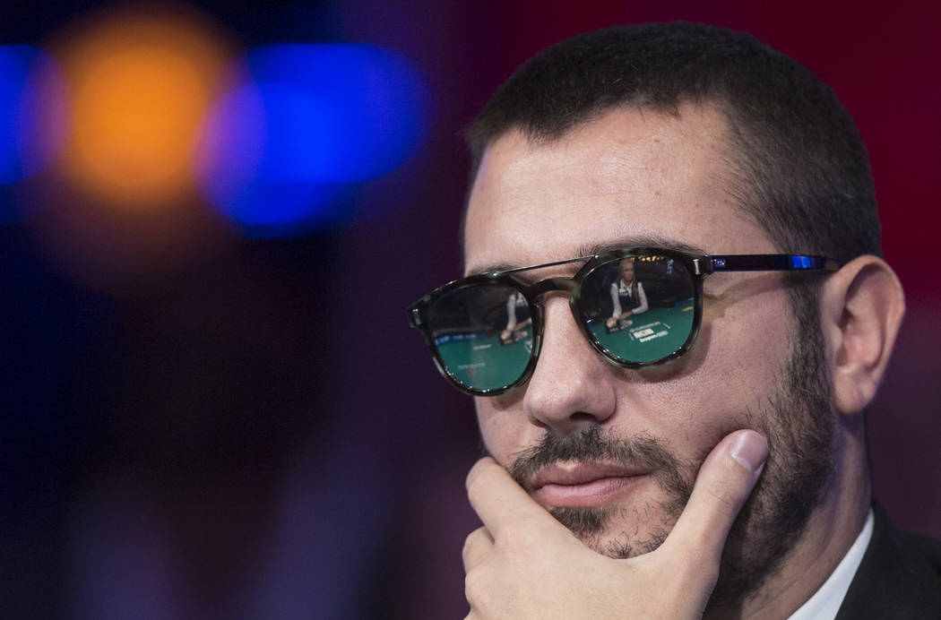 Dario Sammartino, from Italy, watches the dealer during the World Series of Poker Main Event on ...