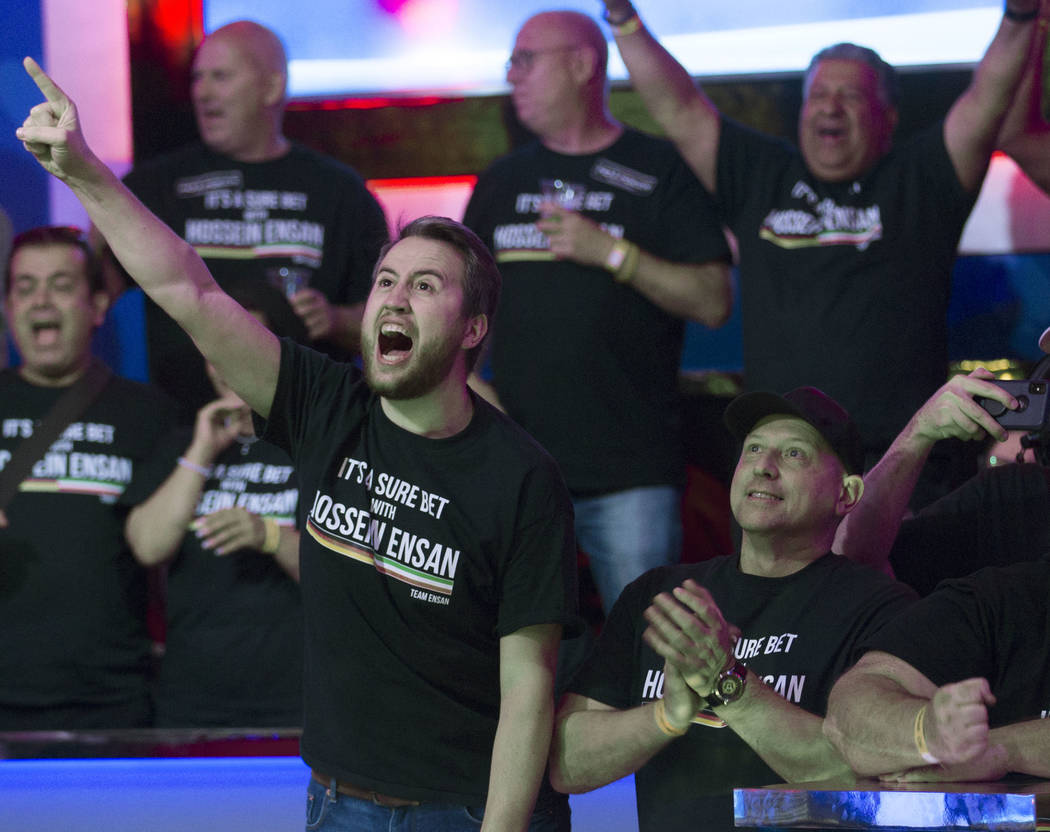 Fans of German poker player Hossein Ensan cheer during the World Series of Poker Main Event on ...