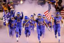 Boise State cornerback Avery Williams (26) carries the hammer as he leads Boise State on to the ...