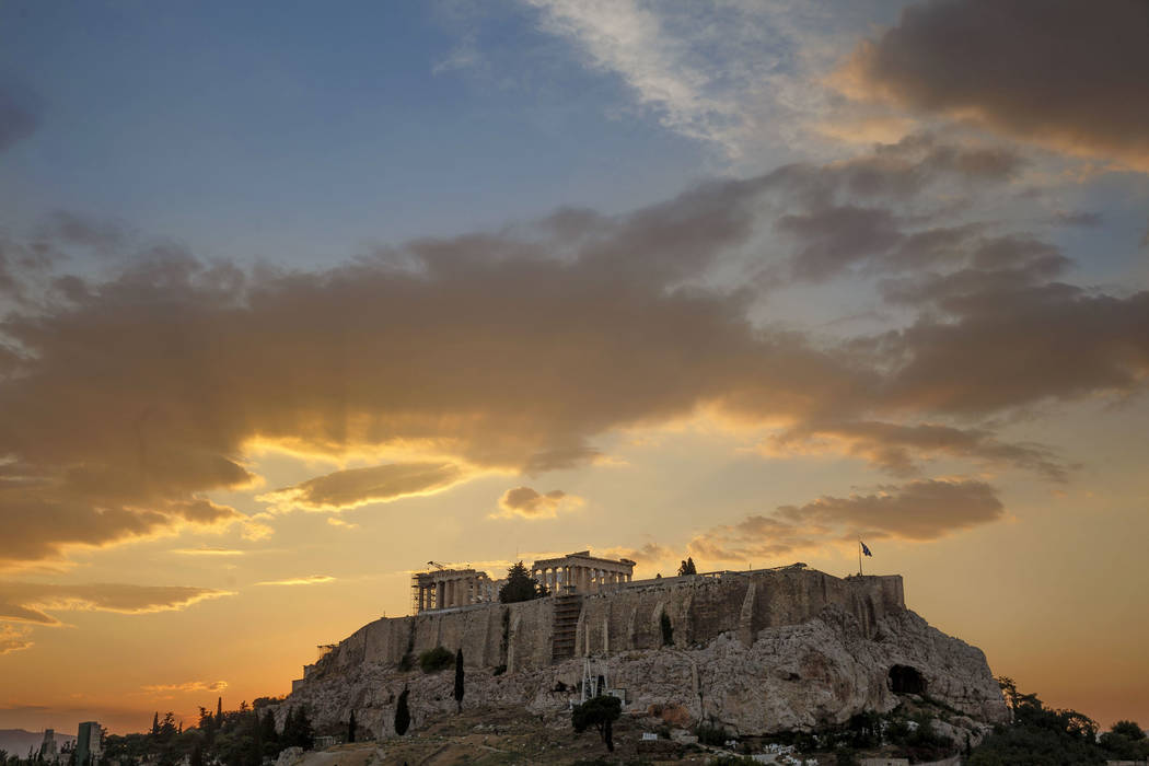 In this file photo dated June 27, 2015, the ancient Acropolis hill, with the ruins of the fifth ...