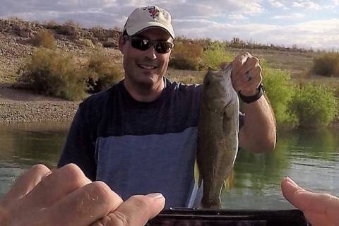 You can’t catch your best-ever smallmouth bass without taking a picture. Jed Topham of Hender ...