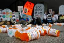 In an April 5, 2019, file photo, containers depicting OxyContin prescription pill bottles lie o ...