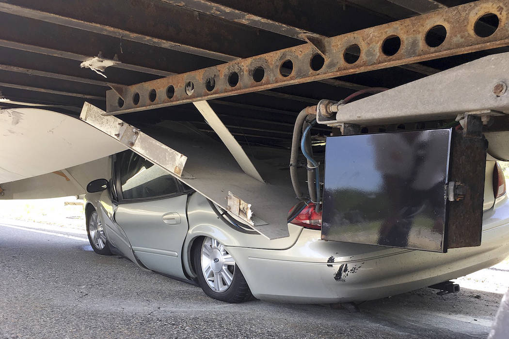 Driver suffers minor injuries when car slides under tractortrailer Nation and World News