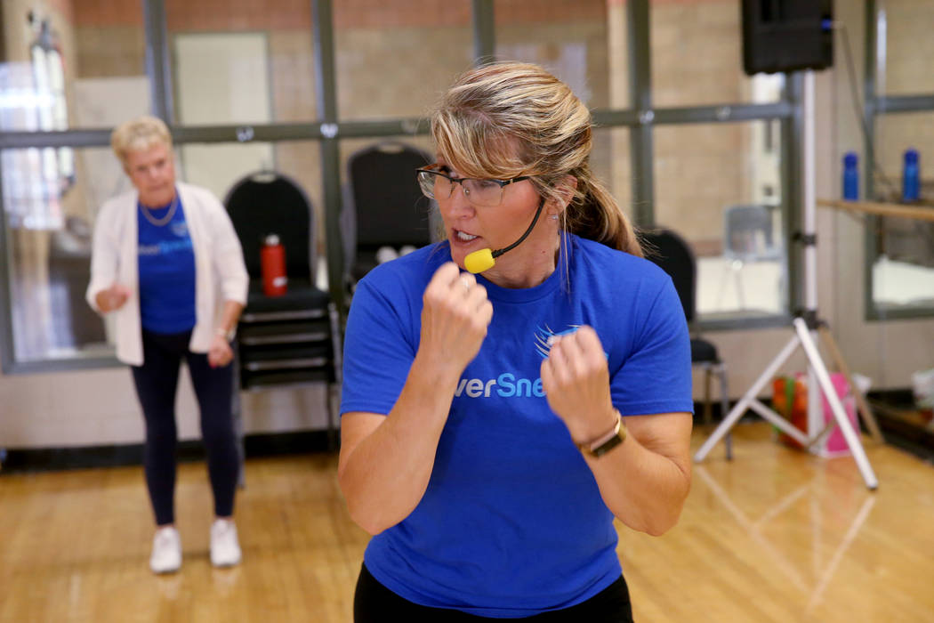 Anita Stephens leads a STRONG by Zumba class as part of the SilverSneakers fitness program at D ...