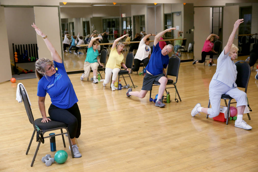 Anita Stephens teaches a Body Flow class as part of the SilverSneakers fitness program at Duran ...
