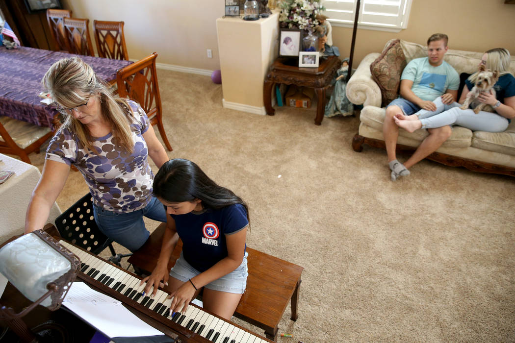 Anita Stephens, left, hangs out with adopted daughter Serra Stephens, 14, at their Las Vegas ho ...
