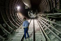 U.S. Rep. Greg Walden, R-Ore., walks through a tunnel extending from the south portal during a ...