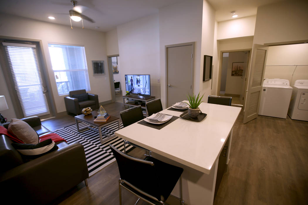 The common living area of a four-bedroom unit at The Degree, a recently-opened 226-unit on-camp ...