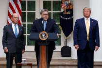 Attorney General William Barr speaks as he stands with Commerce Secretary Wilbur Ross, left, an ...