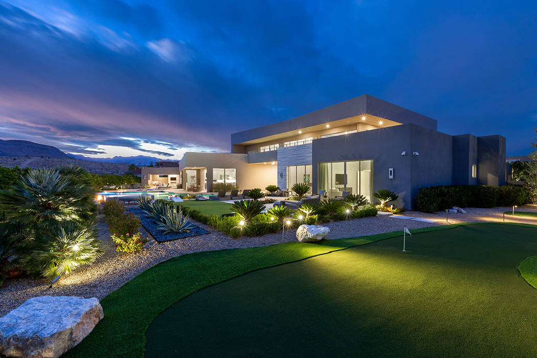 The custom residence features a putting green. (Ivan Sher Group)