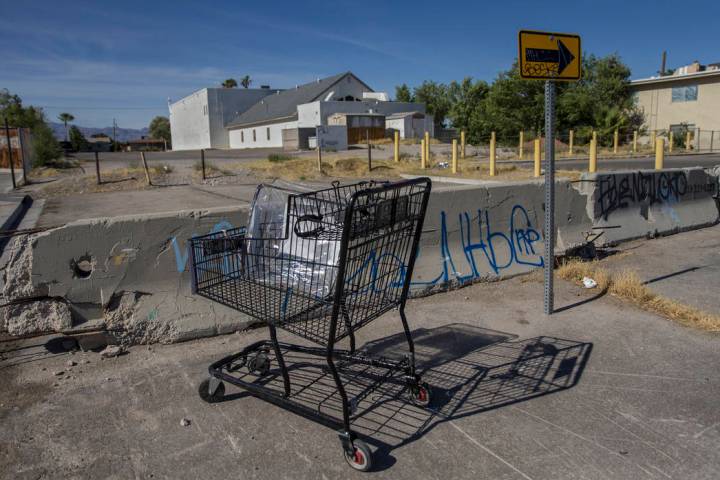 An abandoned shopping cart filled with trash at the intersection of West Warren Drive and North ...