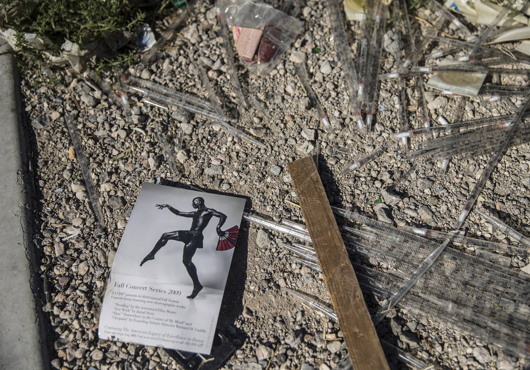 Unused syringes are mixed in with other trash near the intersection of West Charleston Boulevar ...