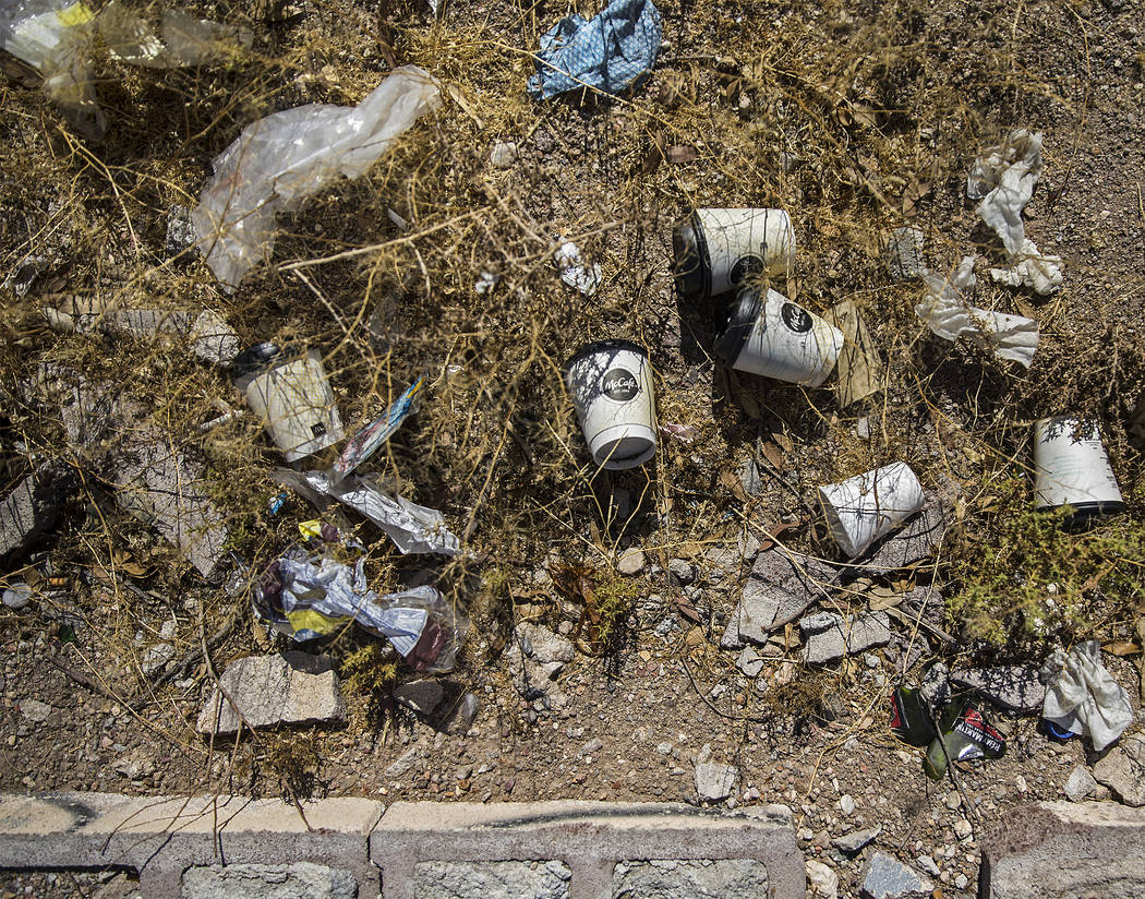 Trash piles up in a field on H Street near West Bonanza Road on Wednesday, July 17, 2019, in La ...