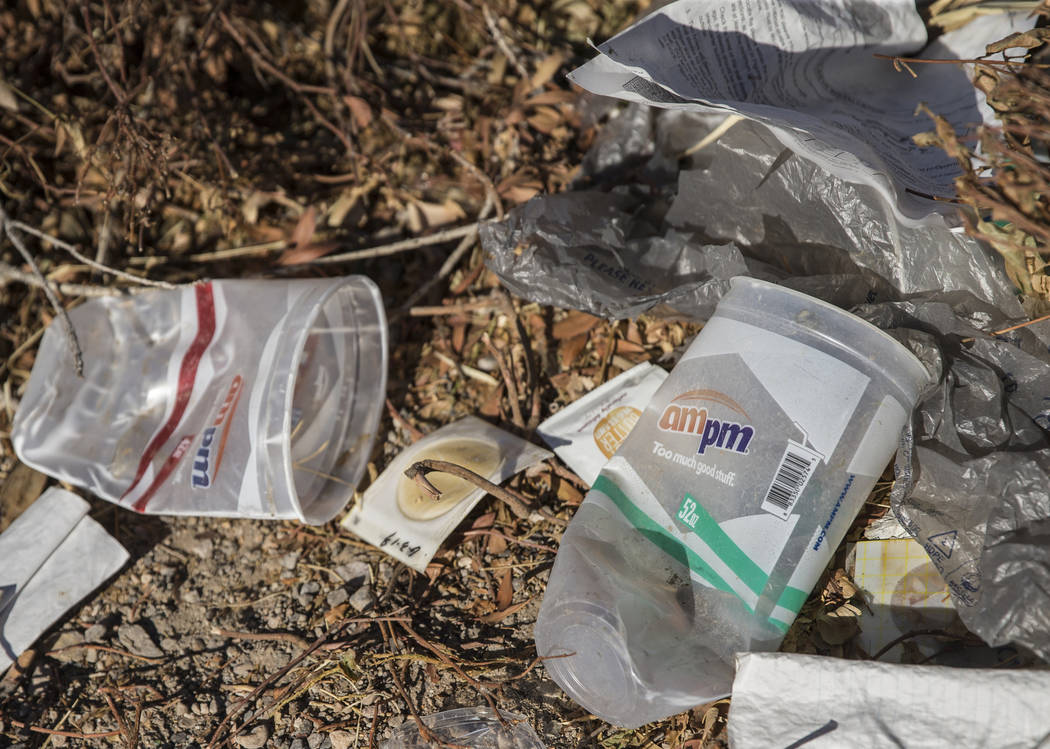 Trash piles up in a field on H Street near West Bonanza Road on Wednesday, July 17, 2019, in La ...