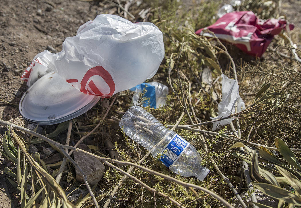 Trash piles up in a field on H Street near West Bonanza Road on Wednesday, July 17, 2019, in La ...