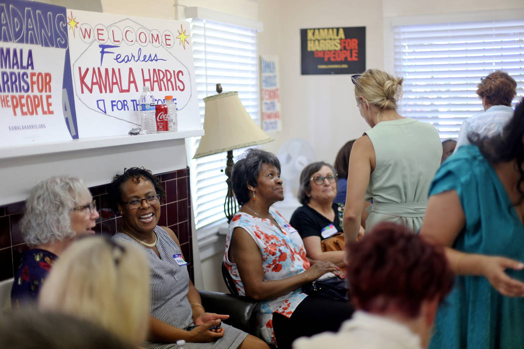 Guests socialize at a meet-n-greet with campaign staff at the new office for Kamala Harris' 202 ...