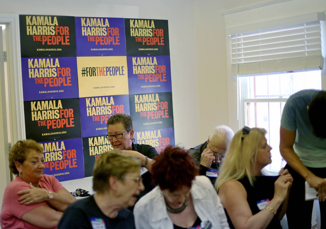 Guests socialize at a meet-n-greet with campaign staff at the new office for Kamala Harris' 202 ...