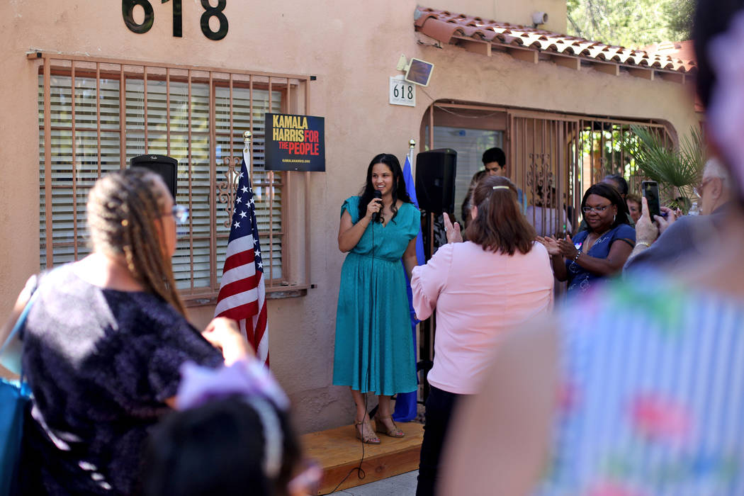 Rachel Pinto, a field organizer, addresses guests at a meet-n-greet with campaign staff at the ...