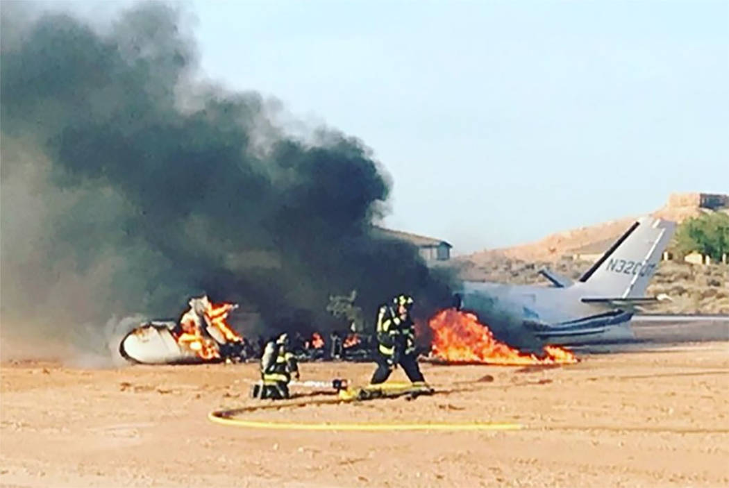 Firefighters work at the scene of a plane crash at Mesquite Municipal Airport on Wednesday, Jul ...