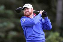 JB Holmes of the US plays off the 5th tee during the first round of the British Open Golf Champ ...