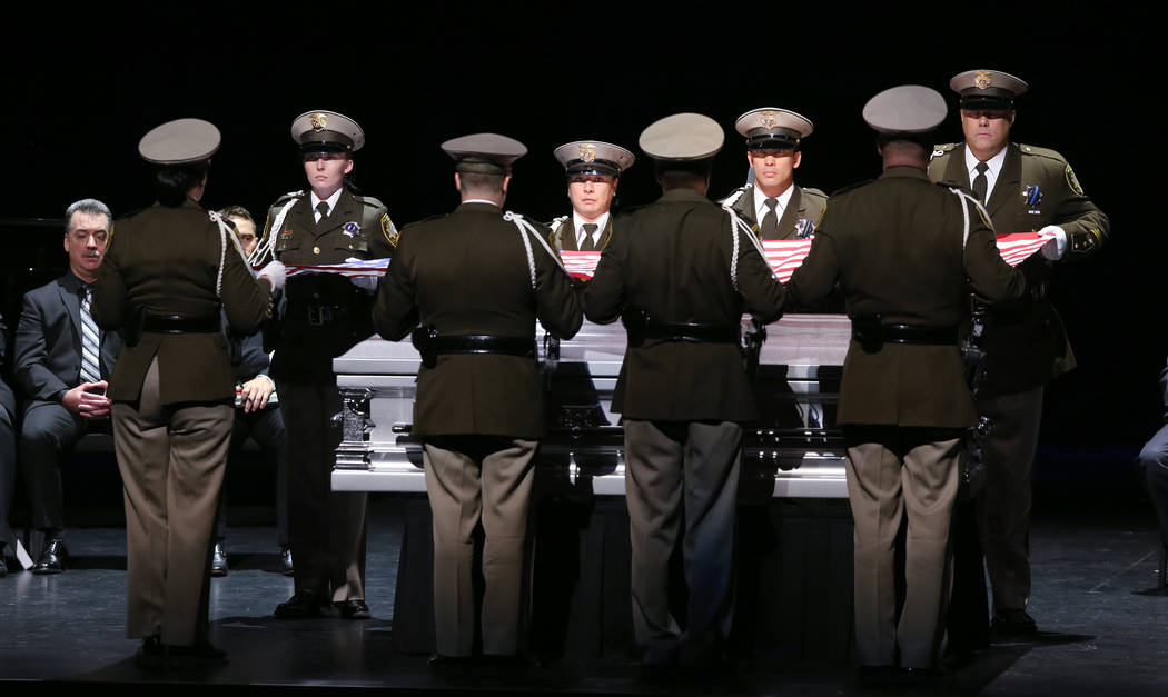 Las Vegas police honor guard prepare the flag during funeral services for former Metropolitan P ...