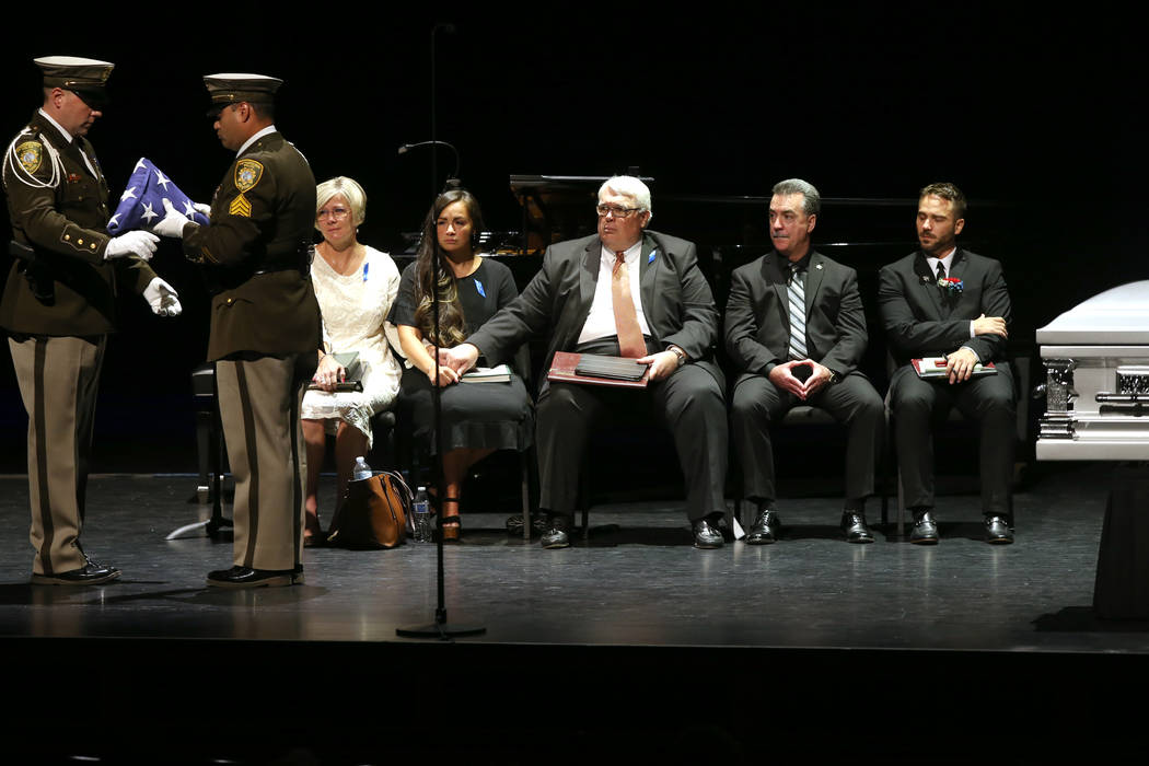 Las Vegas police honor guard prepare the flag during funeral services for former Metropolitan P ...