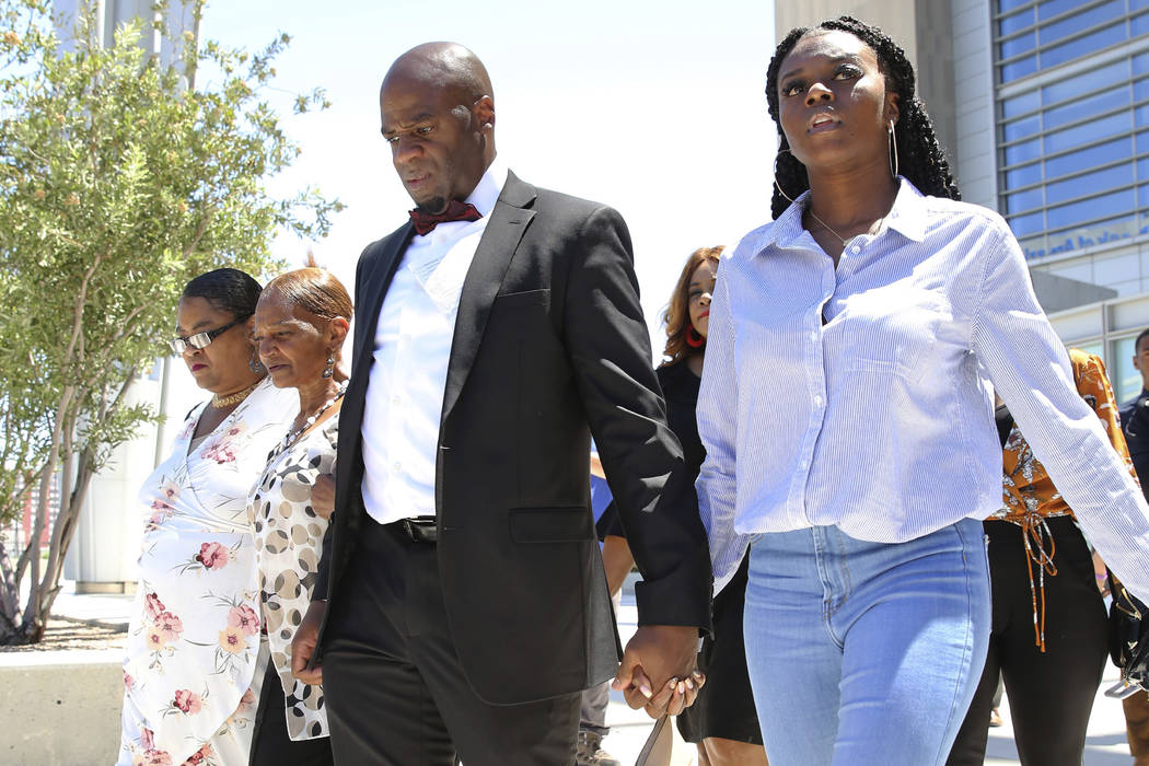 Former Nevada Senate Majority Leader Kelvin Atkinson, center, who pleaded guilty to misusing ca ...