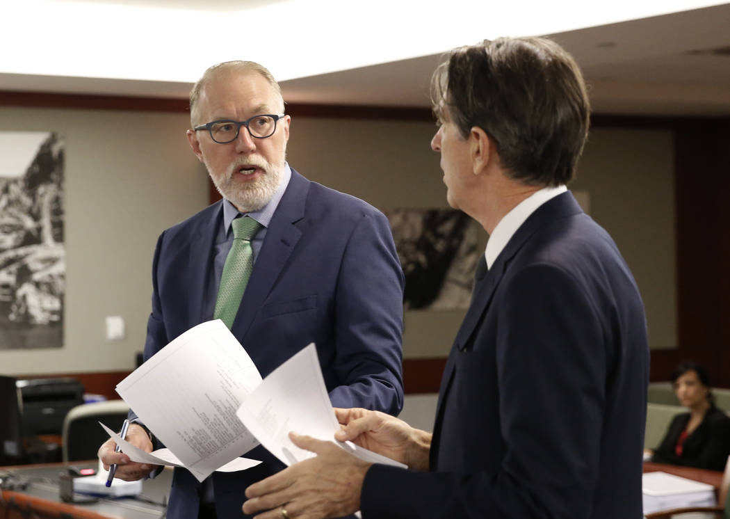 Attorneys representing MGM Resorts International, Todd Bice, left, and Michael Doyen discuss in ...