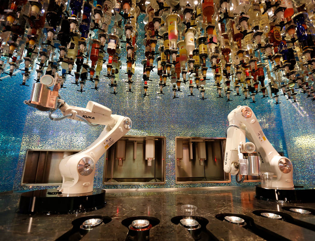 Robots demonstrate to make drinks at Tipsy Robot in the Miracle Mile Shops in Las Vegas, Monday ...