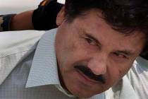 In a Feb. 22, 2014, file photo, Joaquin "El Chapo" Guzman is escorted to a helicopter in handcu ...