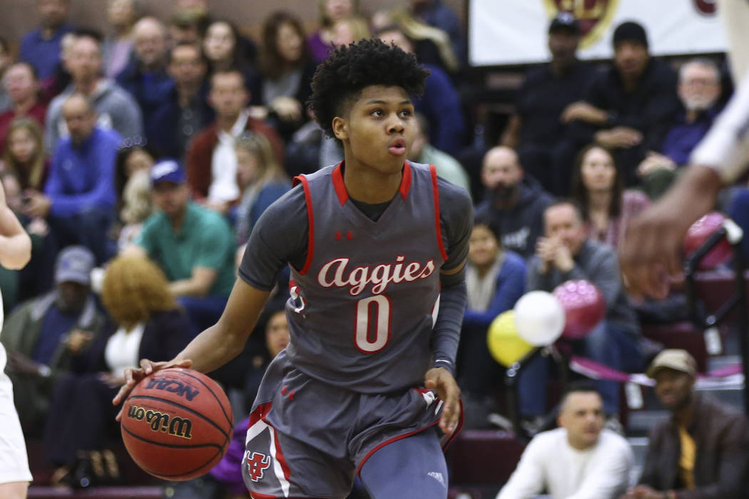 Arbor View's Donavan Yap (0) drives the ball during the first half of a basketball game at Fait ...