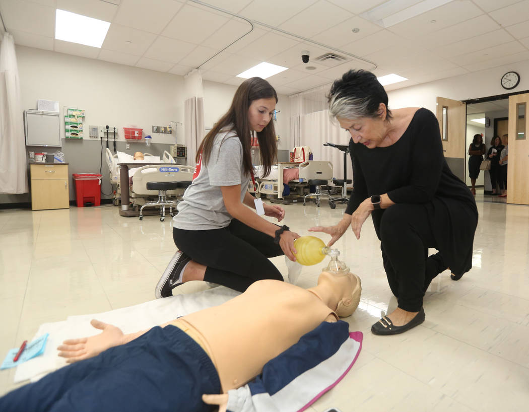 Student Vanessa Panfil, 17, receives help from Associate Dean for Faculty Affairs, Dr. Mary Bon ...