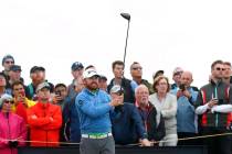 J.B. Holmes of the United States lines up his tee shot on the 14th during the second round of t ...