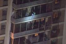 This image taken from video provided by WPVI-TV shows a man scaling down the side of a 19-story ...