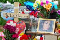 A memorial of flowers, balloons, a cross and photo of victim Marlen Ochoa-Lopez, are displayed ...