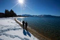In a March 5, 2018 file photo, sunlight shimmers off the snow and waters of Lake Tahoe in South ...