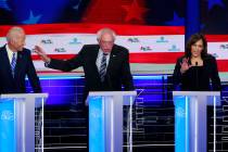 Democratic presidential candidate Sen. Bernie Sanders, I-Vt., center, and Sen. Kamala Harris, D ...