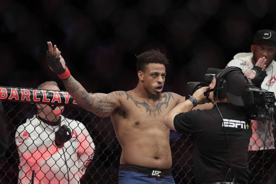 Greg Hardy reacts as he is announced for a heavyweight mixed martial arts bout against Allen Cr ...