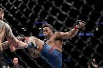 Greg Hardy kicks Allen Crowder during the first round of a heavyweight mixed martial arts bout ...