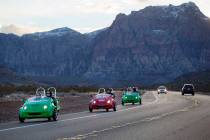 Scooter cars pass through the Red Rock Canyon National Conservation Area outside of Las Vegas o ...