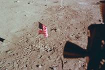 This July 21, 1969 photo made available by NASA shows Tranquility Base and the U.S. flag from a ...