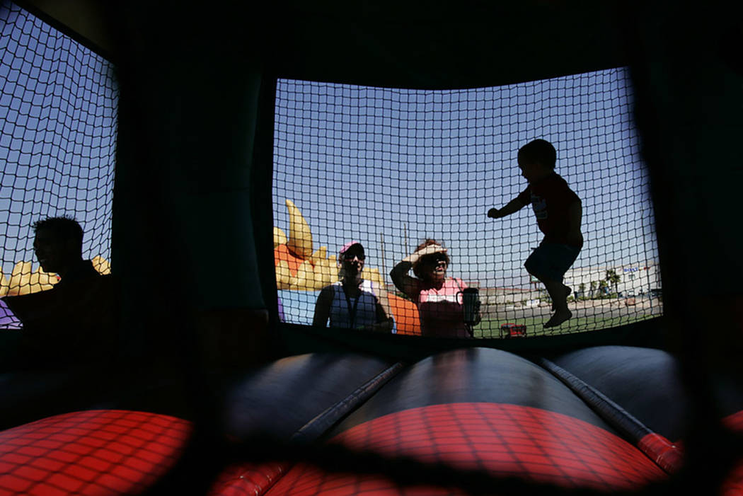 Kids play inside a bounce house. (Las Vegas Review-Journal)