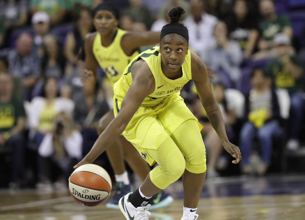 Seattle Storm's Jewell Loyd brings the ball up against the Las Vegas Aces during the first half ...