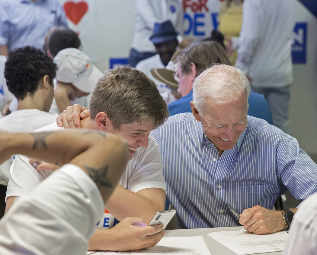 Democratic presidential candidate former Vice President Joe Biden, right, shares a laugh with A ...