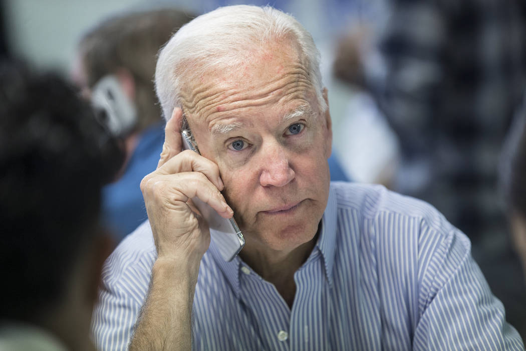 Democratic presidential candidate former Vice President Joe Biden makes phone calls during the ...