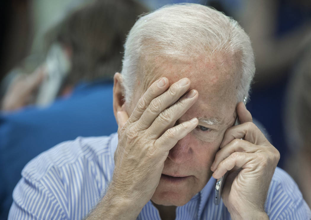 Democratic presidential candidate former Vice President Joe Biden makes phone calls during the ...