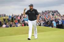 Ireland's Shane Lowry celebrates after making a birdie on the 15th green during the third round ...