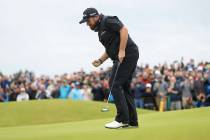 Ireland's Shane Lowry reacts after making a birdie on the 15th green during the final round of ...